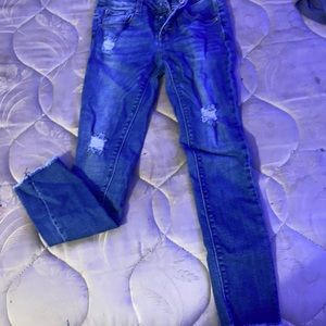 kids ripped blue jeans